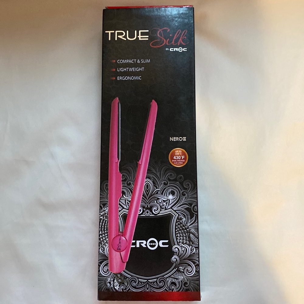 The  Croc Nero Titanium Flat Iron has floating plates and a rounded barrel. NIB